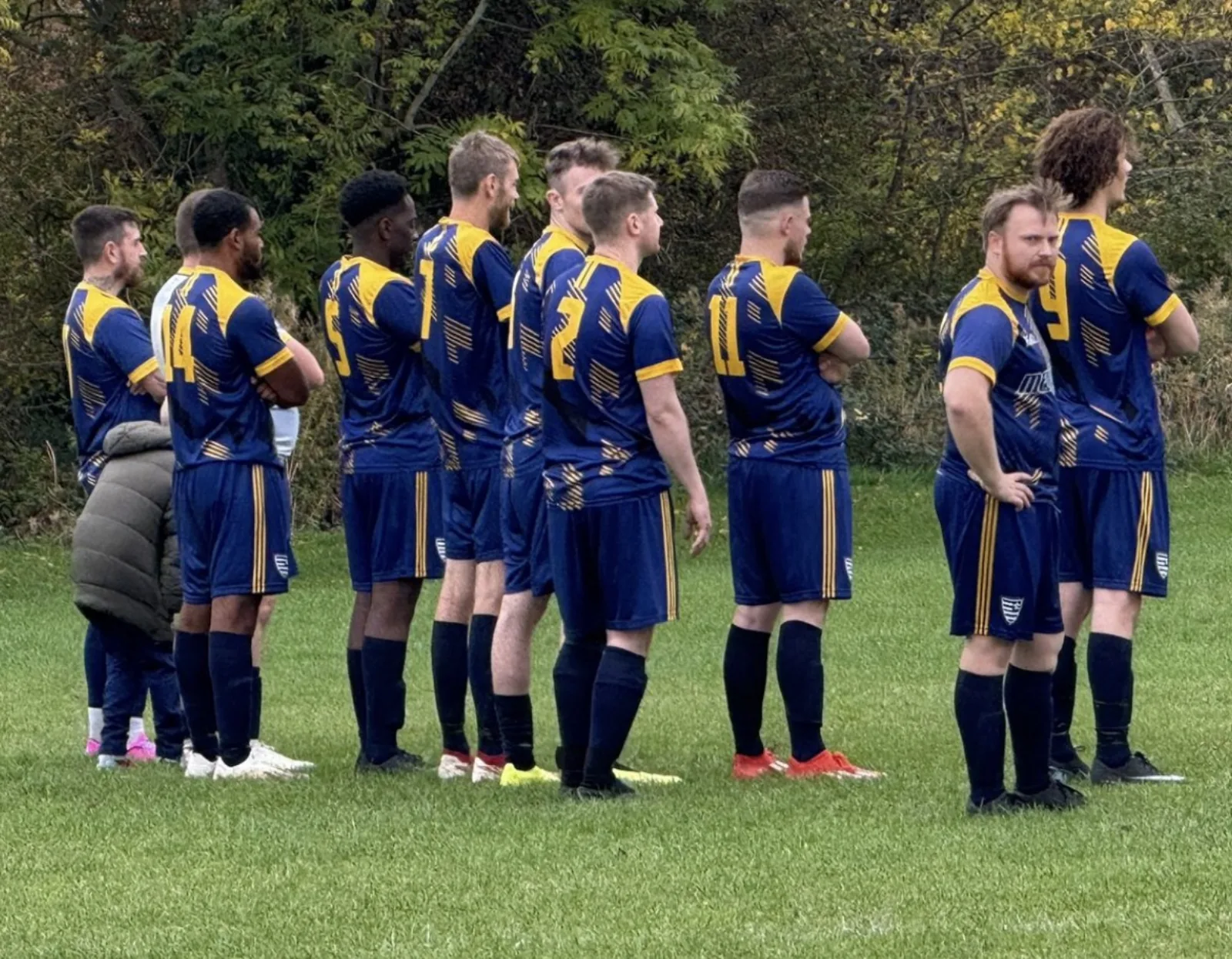 Designing a football crest that survives sublimation, silicone and a Sunday wash — Peaq Journal